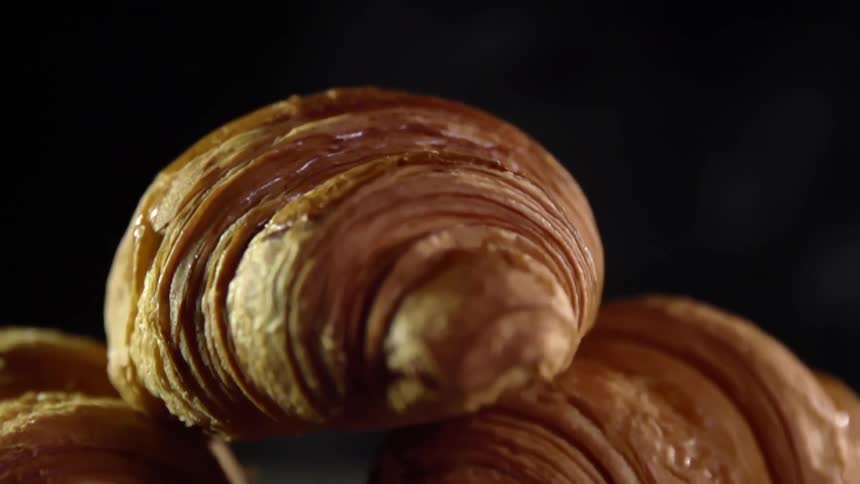 A croissant falling on to other croissants