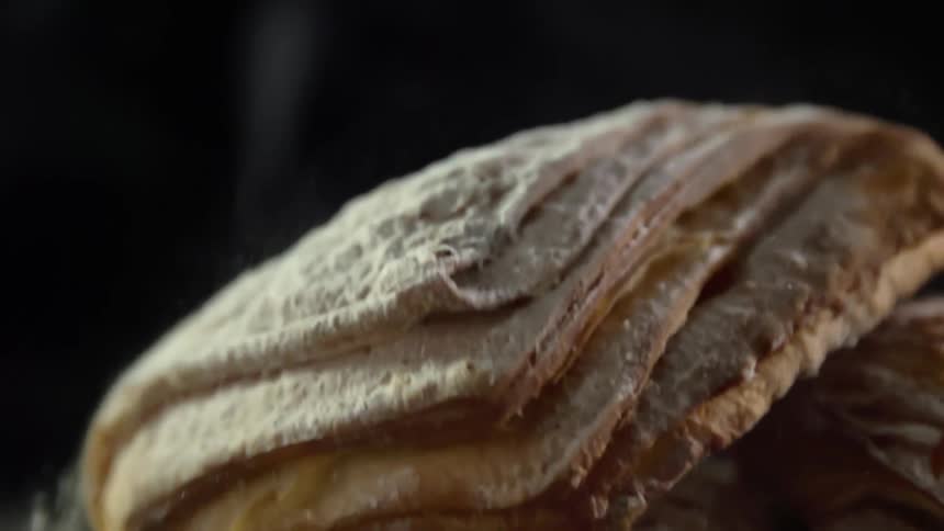 A bread pastry is dropped and bounces