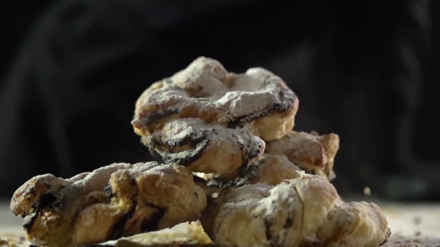 Bread pastries tumble on a wooden table