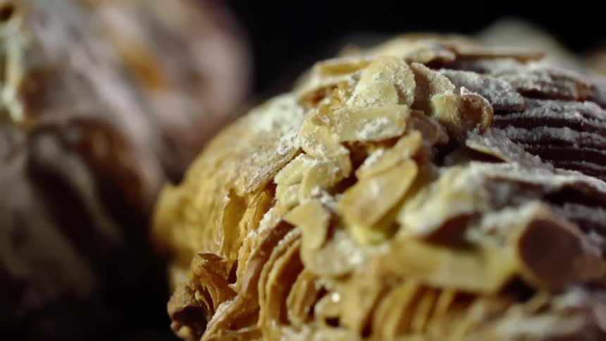 Close up of croissants covered in confectioners sugar