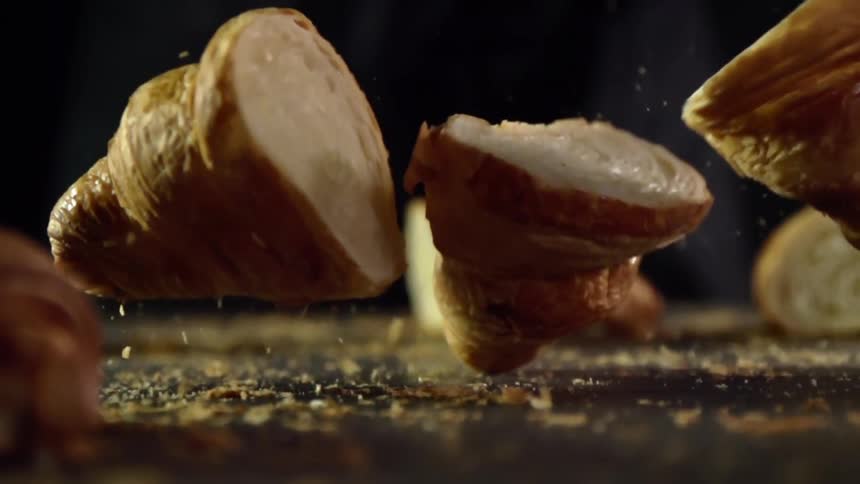 Pieces of croissants drop on the table