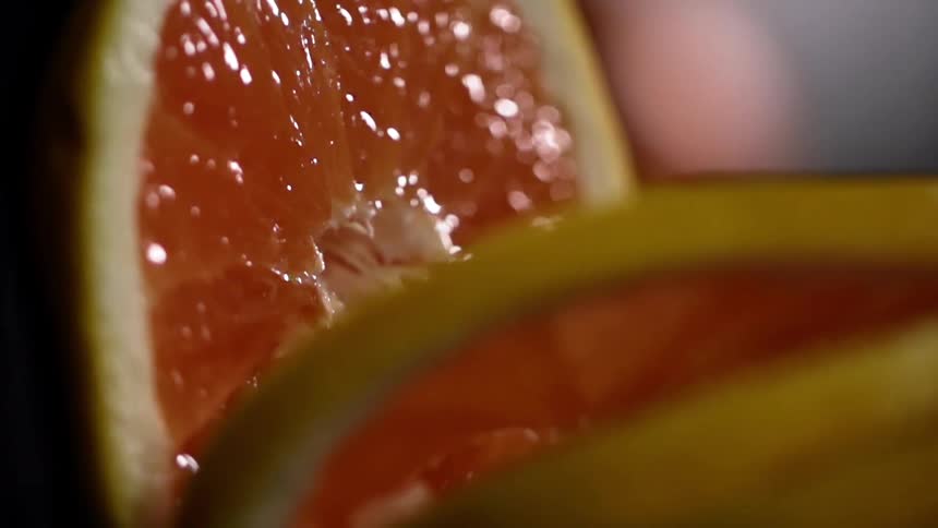 Slices of grapefruit tipping over
