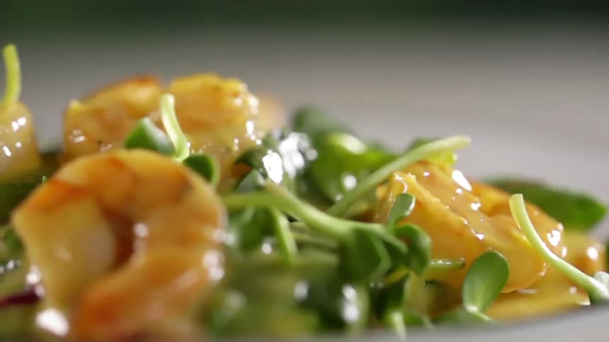 A couple of greens drop into a seafood salad