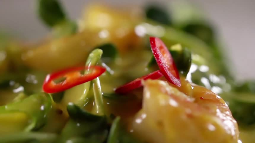 Peppers falling on top of a meal