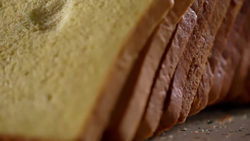 A loaf of bread landing on a counter top