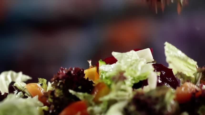 Lettuce falling on top of other vegetables