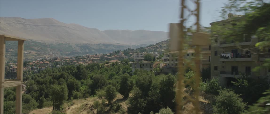 View of a hillside with buildings on the side