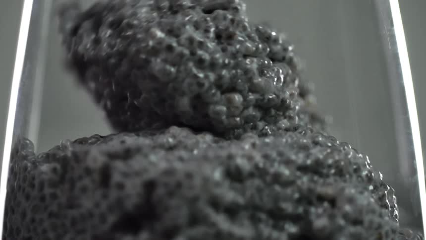 A glass is filled with chia pudding