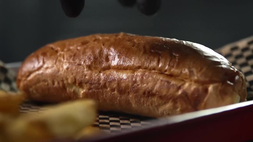 A loaf of bread is place don the pan