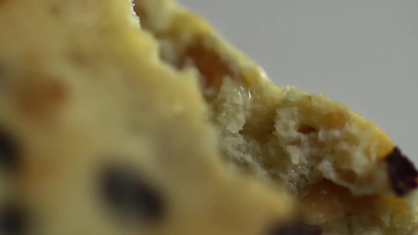 Bread torn in half to show creamy interior texture