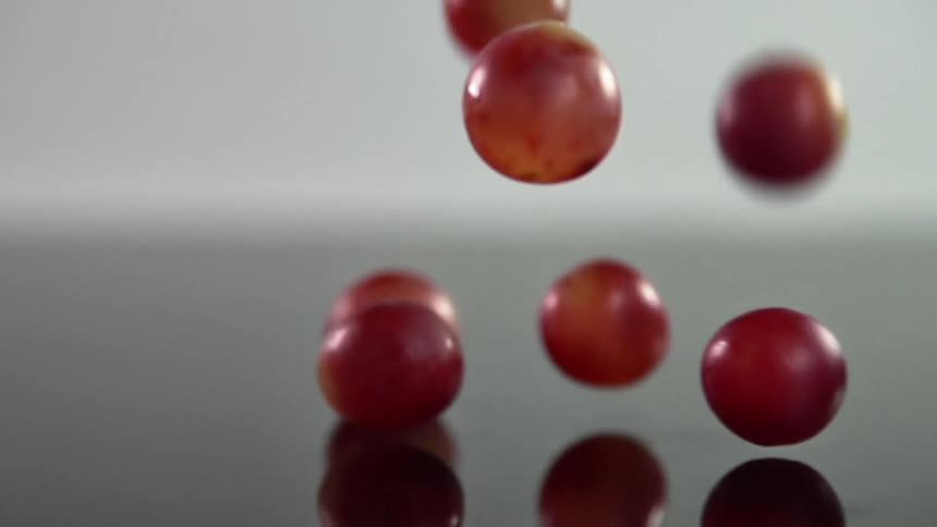 Red grapes fall on the ground