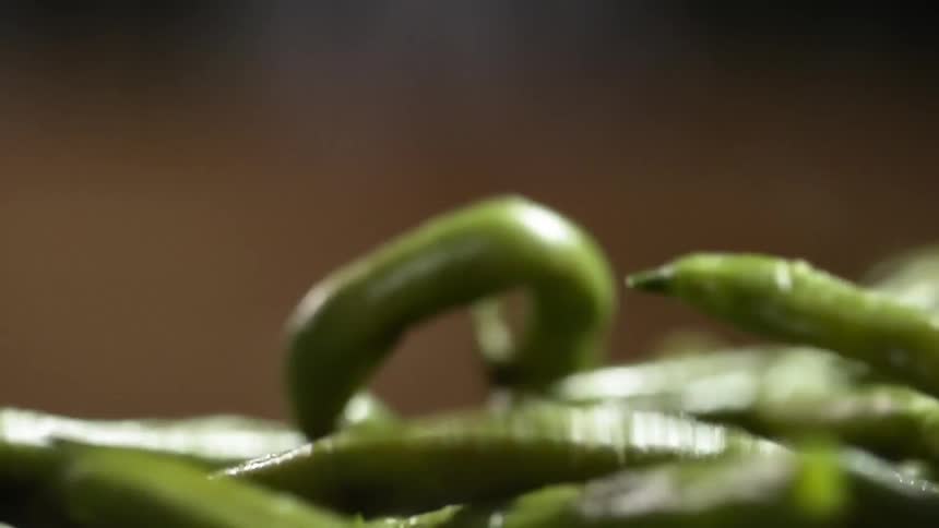 Cooked asparagus falling and bouncing
