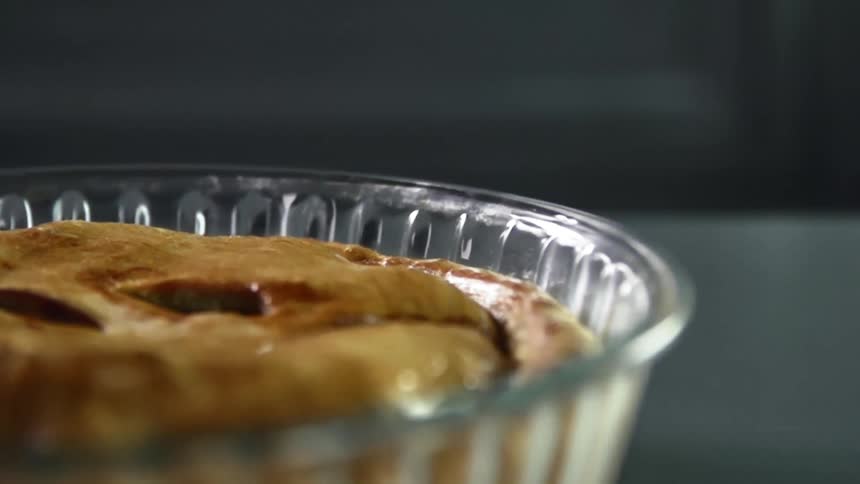 Glazed pie inside a glass pie dish