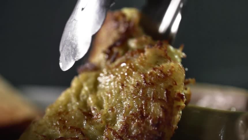 Fried food being plated