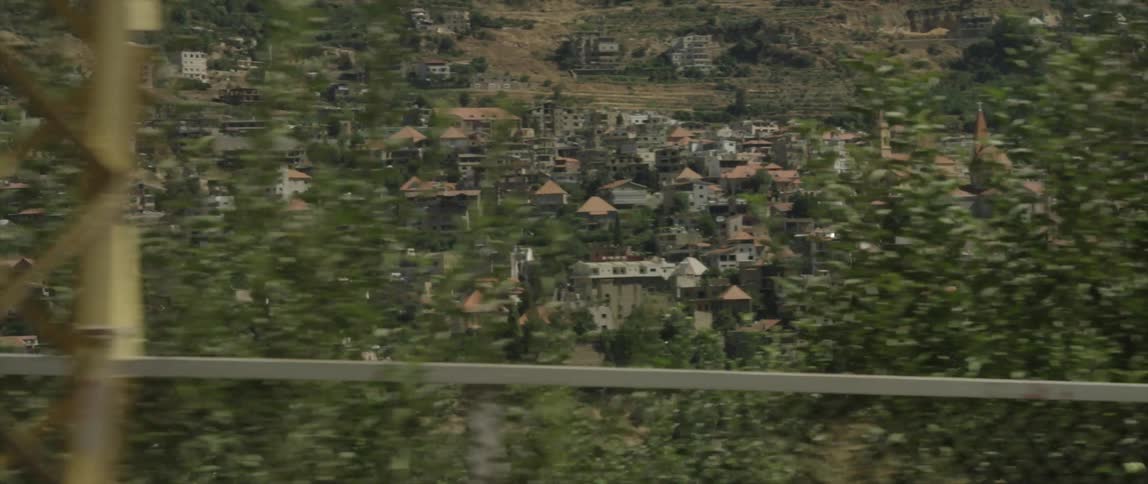 Looking down at a mountain town on the other side of a valley