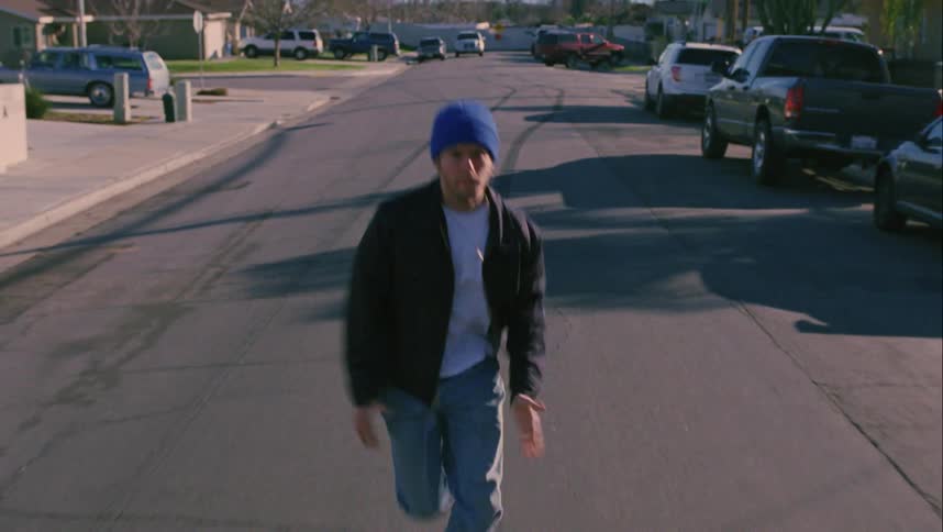 A man is fleeing down the street
