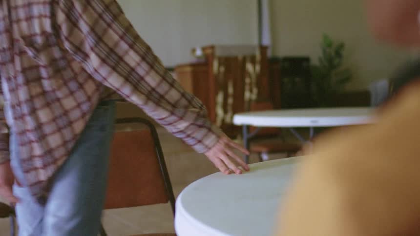 Man leaves upset after talking with woman at round table