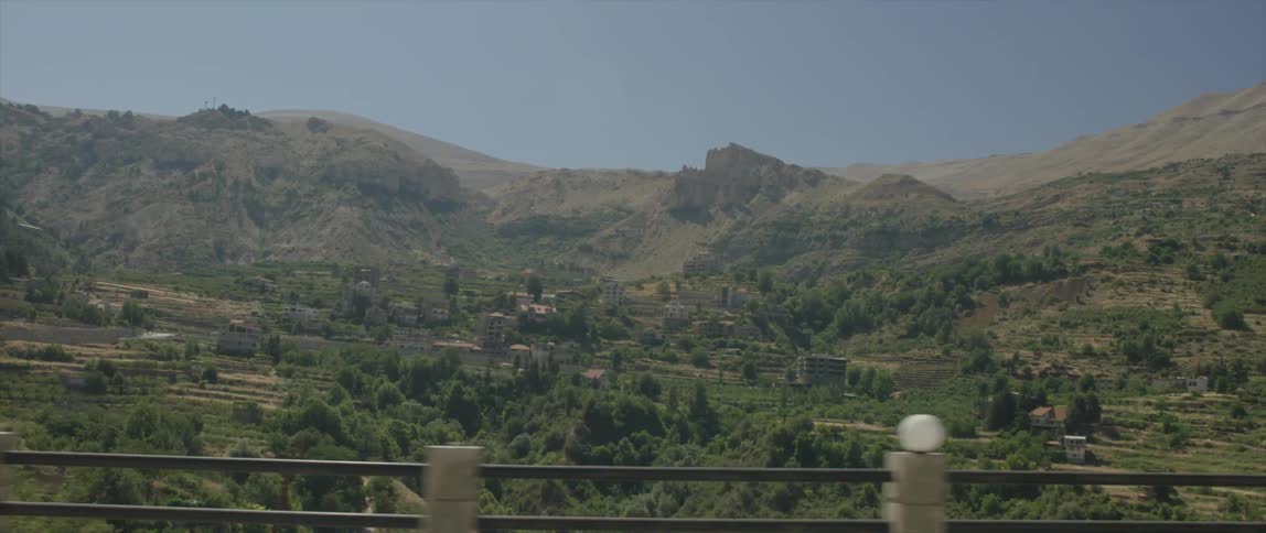 View of a mountainside dotted with buildings