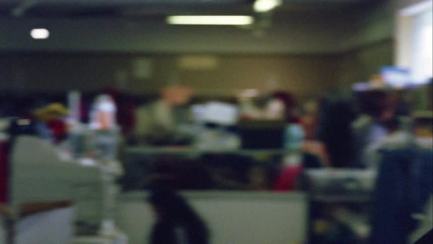 A young man walks very quickly out of a store