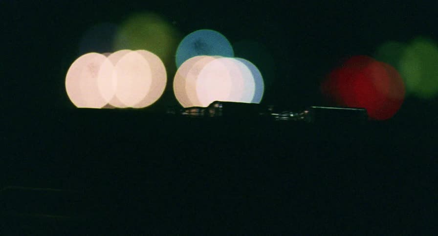 Colorful lights glow and blur at night