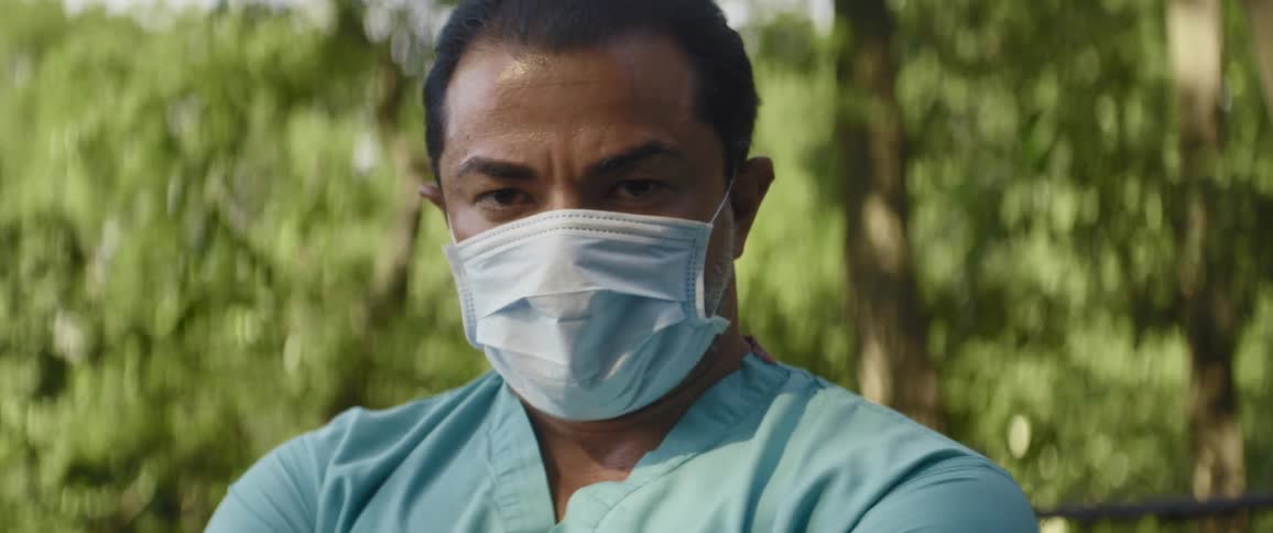 A man is wearing a face mask