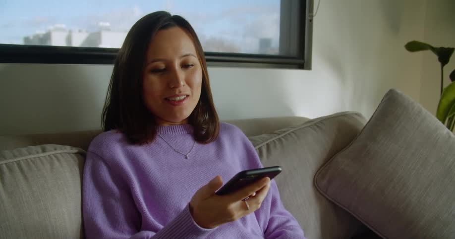 A woman is talking on the cell phone