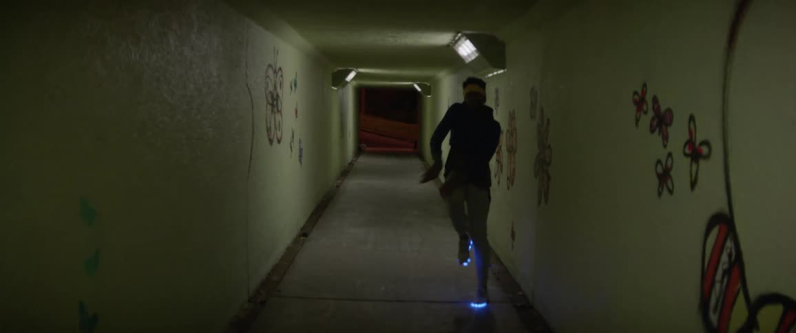 Man dances in a hallway
