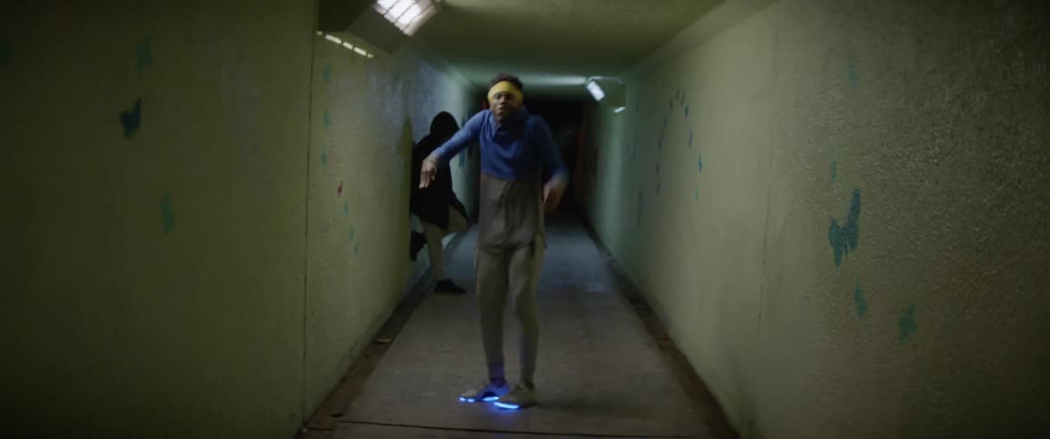 People are dancing in a pedestrian tunnel