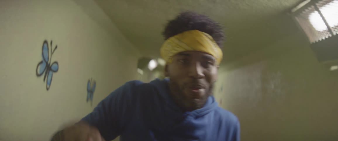 A man dances in a hallway