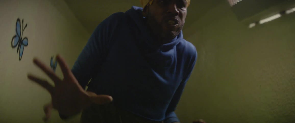 A man dances in a hallway