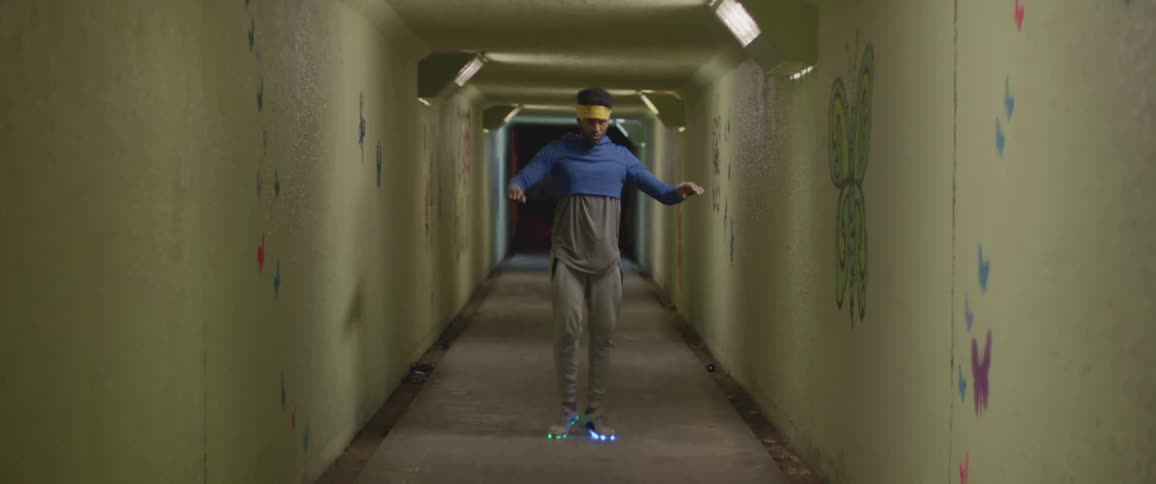 A man is break dancing in the tunnel