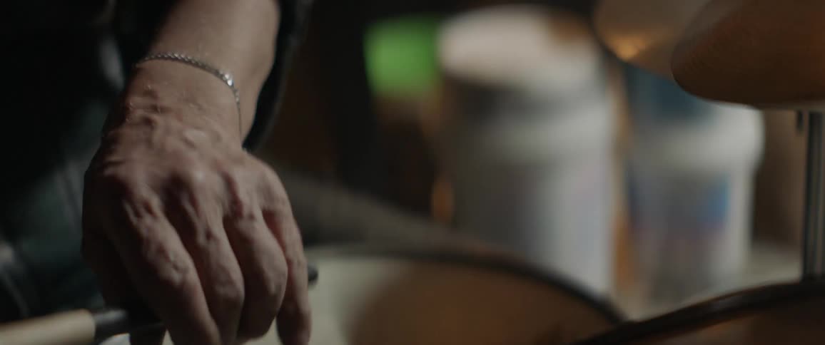 A person plays the drums