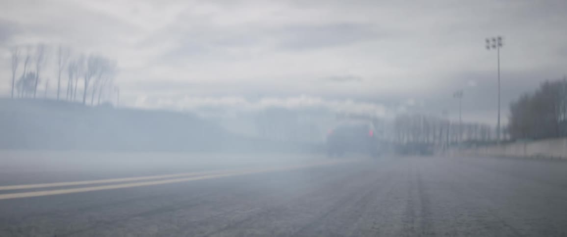 A car speeds down the road