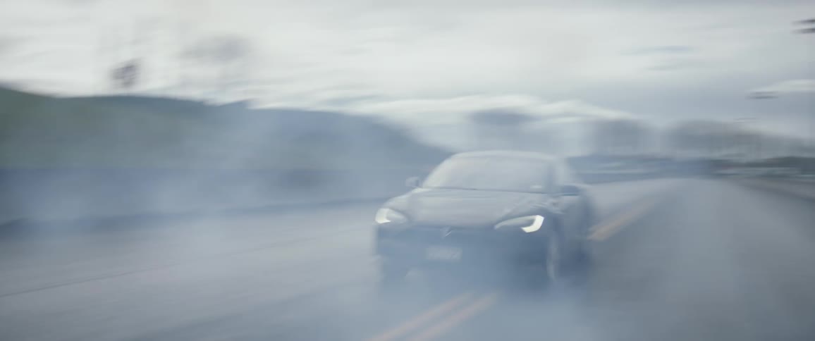A vehicle speeds down the road