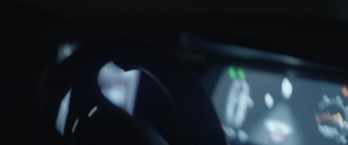 A man steers a car frantically