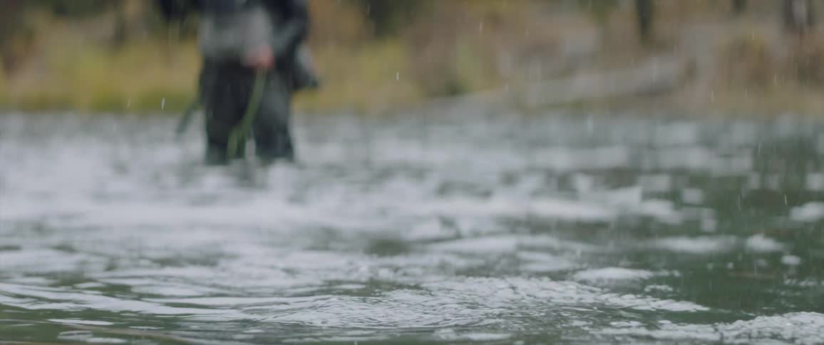 Fisherman fish in the stream waters