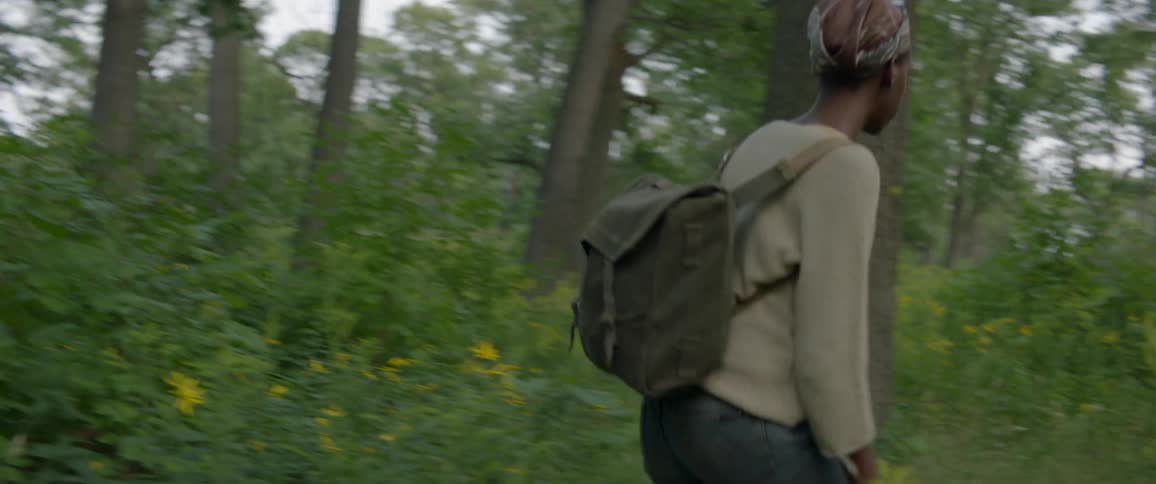 Woman hikes alone in a forest