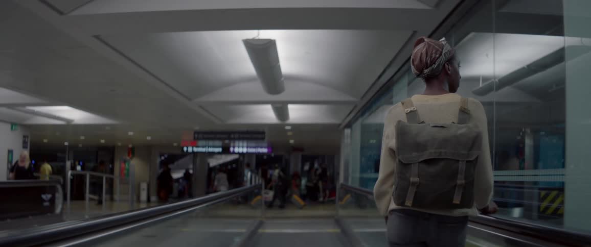 A woman is making her way through the airport