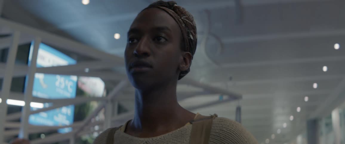 A person is walking in an airline terminal during the day