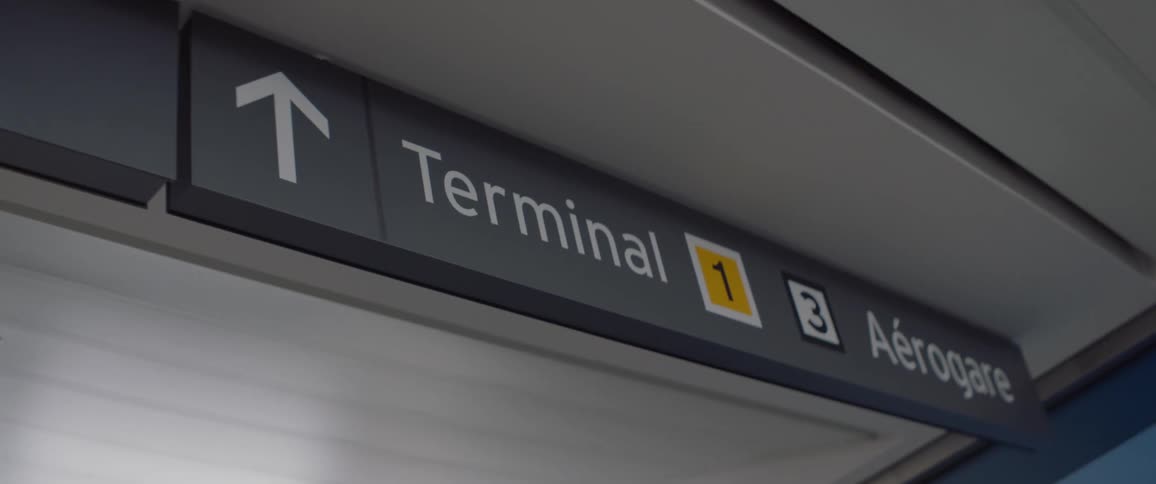 Terminal sign on ceiling in airport