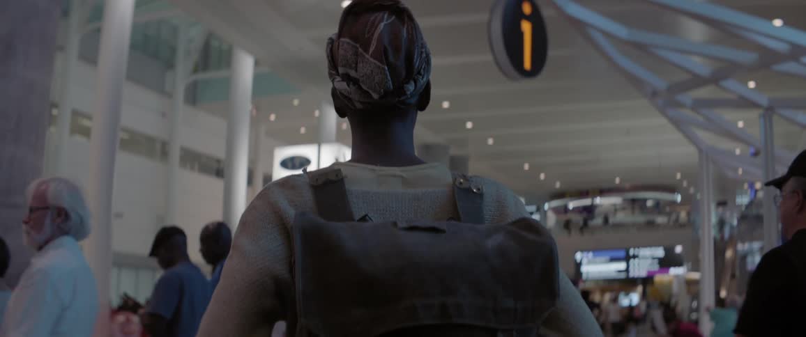 Woman walks through an airport