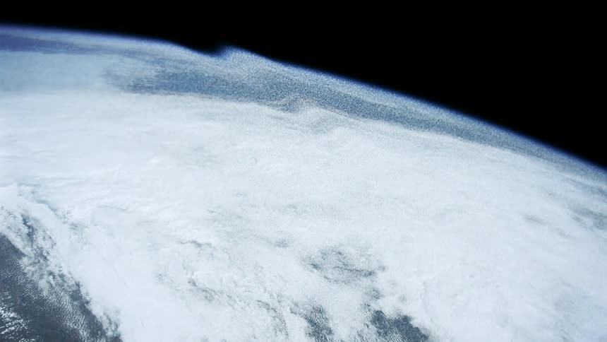 The planet earth can be seen from outer space but its surface appears slightly warped by a subtle wave of distortion