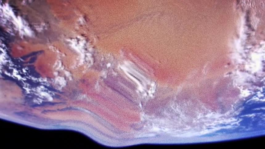 The planet earth can be seen from outer space but it appears warped and distorted