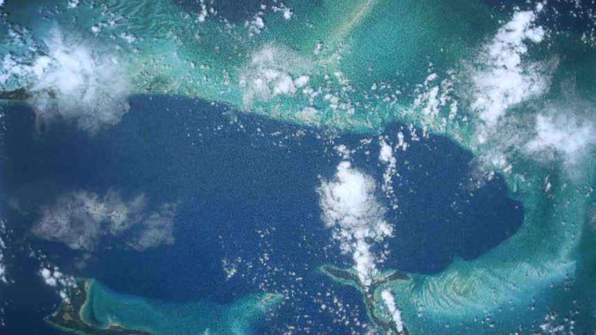 The earth from space with ocean clouds and land