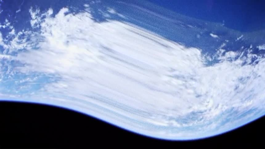 The earth from space with ocean and clouds with black space in the background