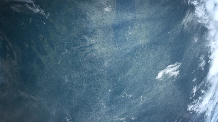 The earth from space with ocean clouds and land