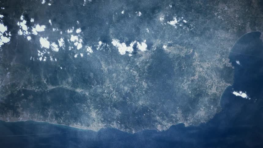 The earth from space with ocean clouds and land