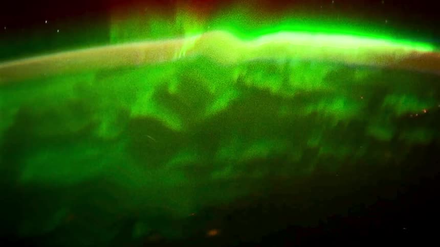 The northern lights shine by the stars