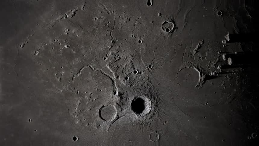 The moon with craters peaks and valleys