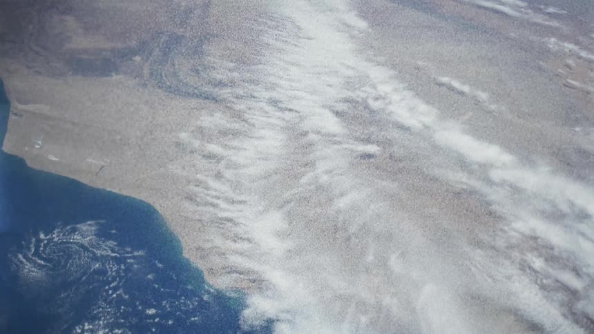 The surface of the planet earth can be seen from outer space but it appears slightly warped by a subtle wave of distortion